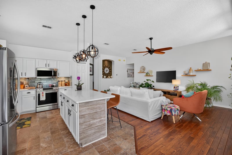 Kitchen island view into family room at 1820 Burgess Hill Dr E, Jacksonville, FL