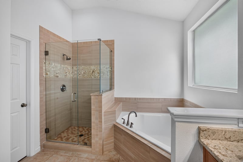 Bathroom glass shower and soaking tub at 3101 E Banister Rd, St. Augustine, FL 32092