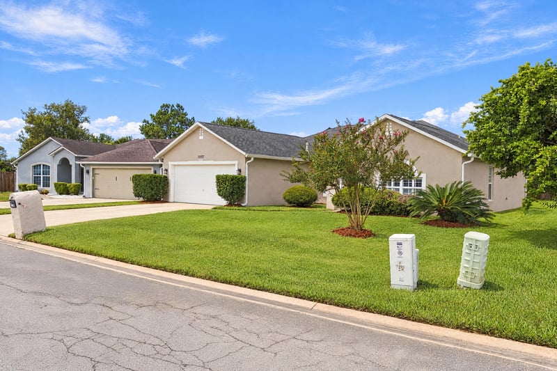 Front exterior wide view with lawn and mailbox at 11197 Illford Dr