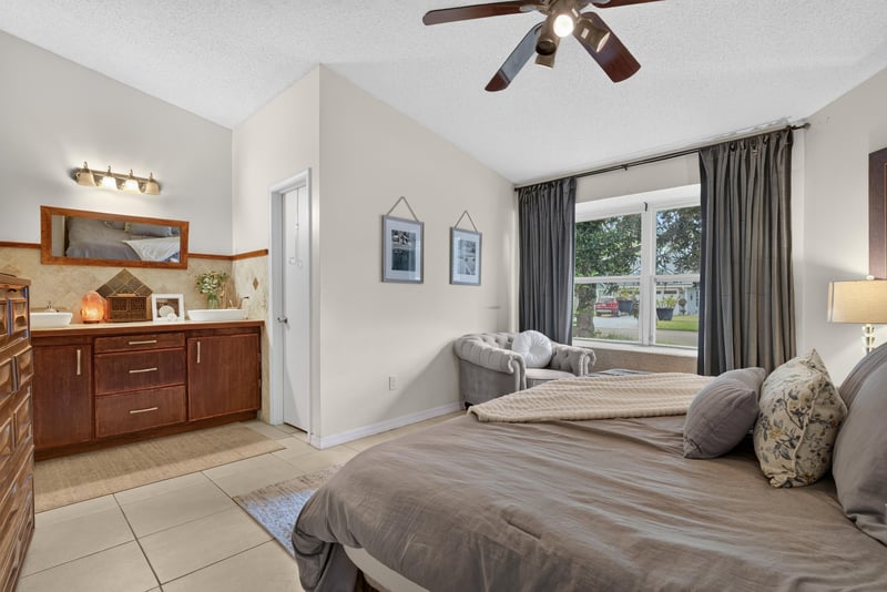 Bedroom with dresser and windows at 13020 Medford Ln, Jacksonville, FL 32225