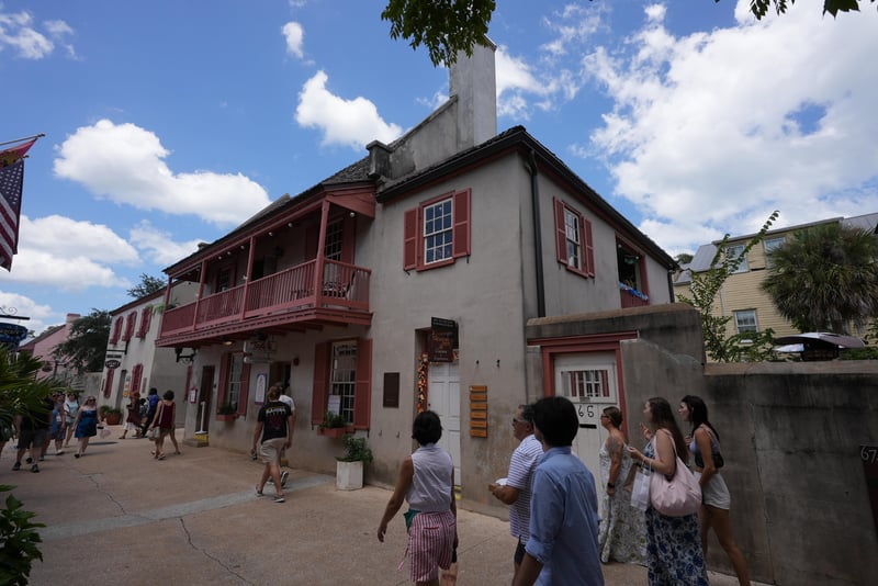 Upper-floor balcony and chimney of the historic building seen from the street at 29 Cuna St, St. Augustine, FL 32084