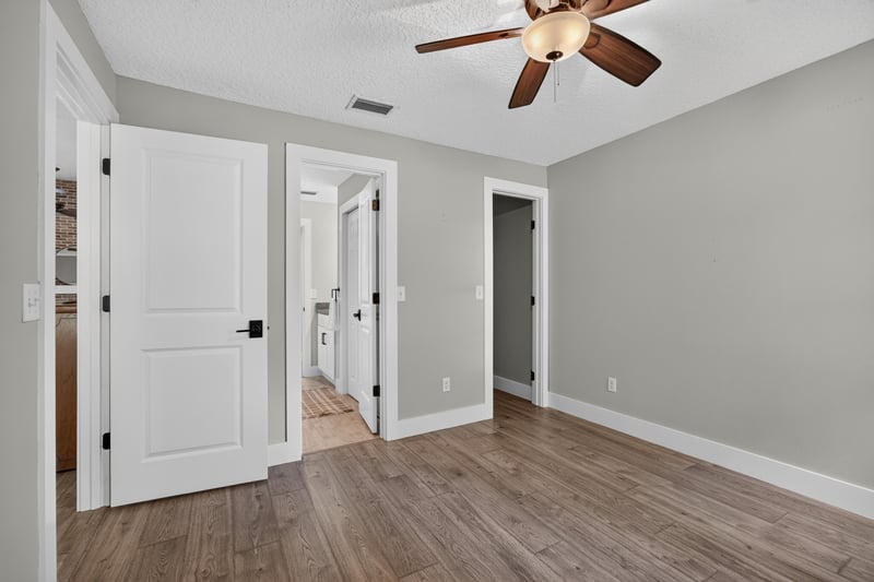 Hallway with multiple doors at 1161 Whispering Pines Rd, Jacksonville, FL 32259