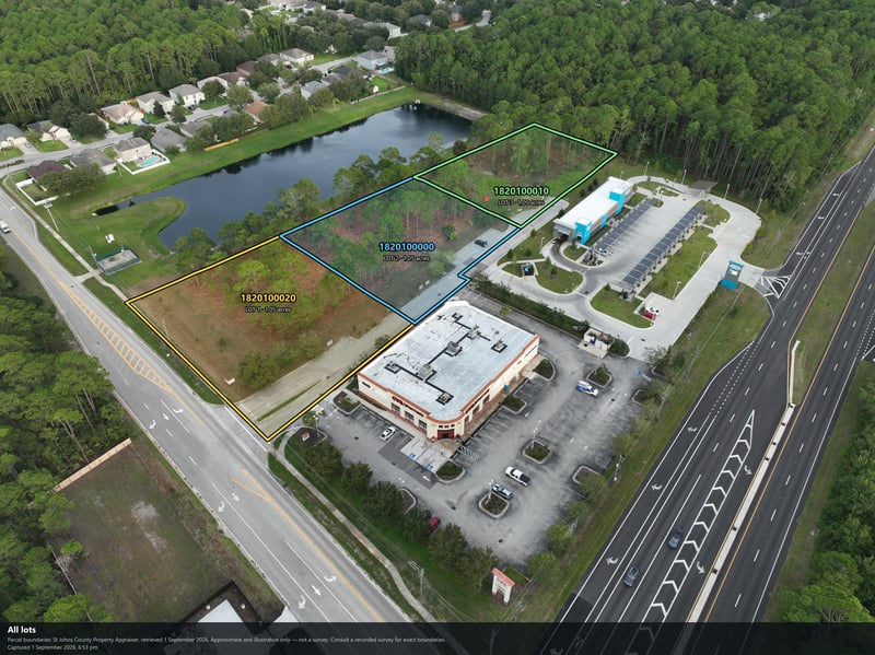 Aerial view of the highway frontage, pond, and commercial building at 4900 US-1, St. Augustine, FL 32086