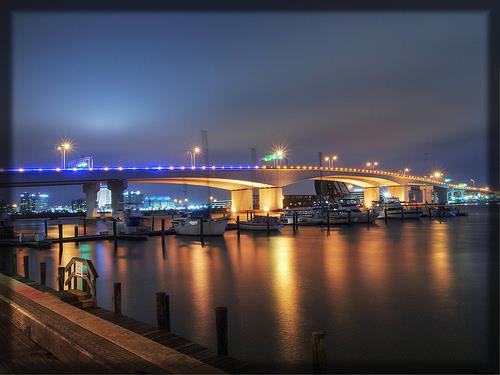 Bridge lights reflected on the river at day-to-dusk in Jacksonville