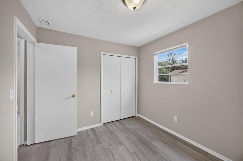 Empty bedroom with closet and window at 1083 Stokes St, Jacksonville, FL