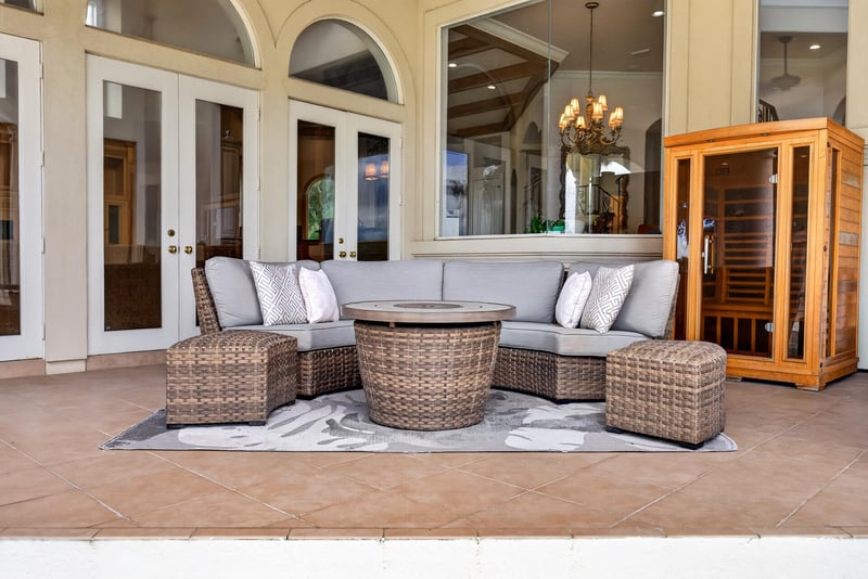 Covered patio seating with fire table at 344 Broward Rd, Jacksonville, FL