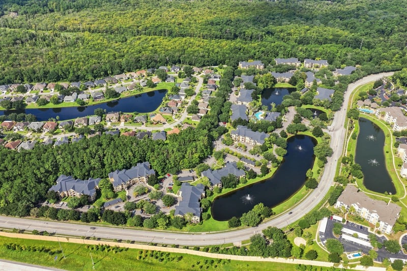 Aerial view of the community with ponds in Reserve at Point Meadows