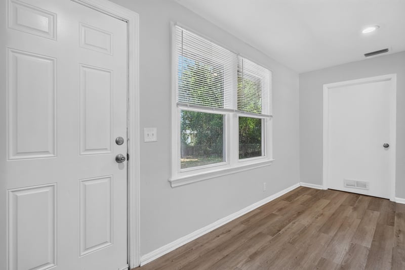 Entry area near front door with wood-look flooring at 855 Cornwallis Dr, Jacksonville, FL