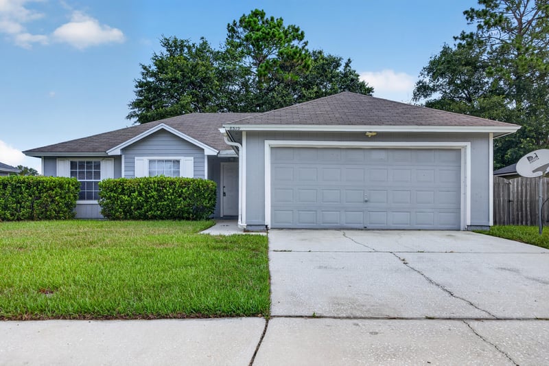 Front exterior, wide angle with landscaping at 8519 Blazing Star Ct, Jacksonville, FL 32210