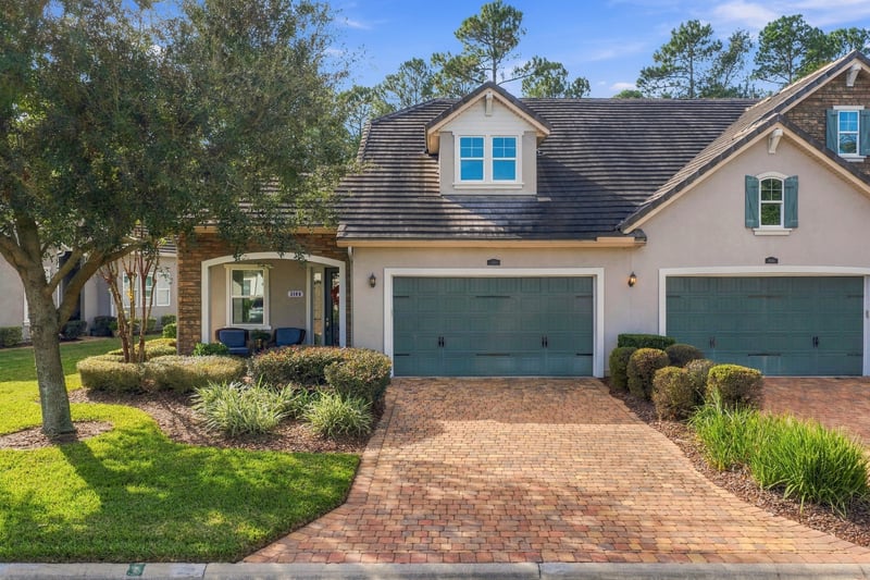 Front exterior with garage and driveway, photographed by Megapixeler on Lucena Ln, Jacksonville, FL