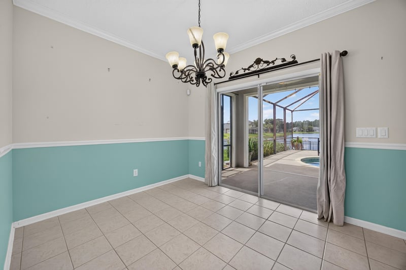 Tile floor room with sliding doors to the pool at 1493 Greyfield Dr, St. Augustine, FL 32092