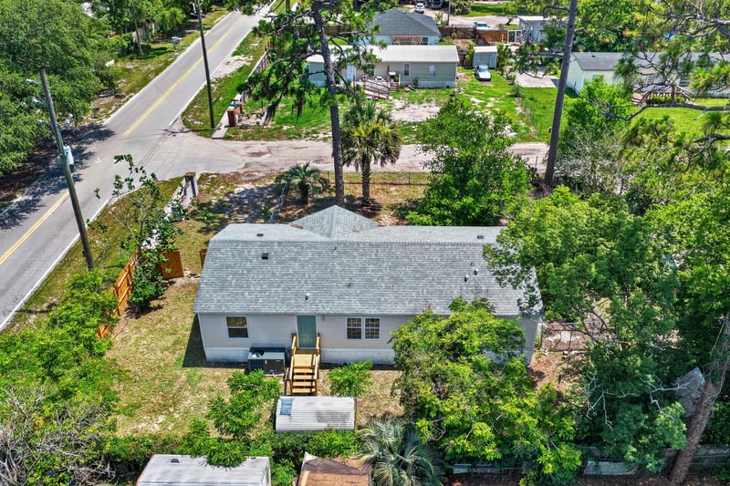 Aerial view of home and street at 7603 Coach Park Dr, Jacksonville, FL 32244