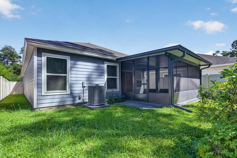 Back exterior with screened lanai at 7118 Preston Pnes Trl, Jacksonville, FL
