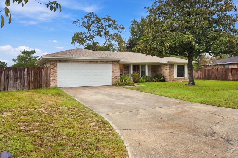 Front exterior with driveway and garage door at 357 Dillon Dr, Orange Park, FL