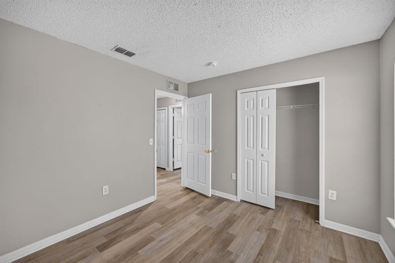 Hallway with closet doors at 1845 Saga Ct, Middleburg, FL
