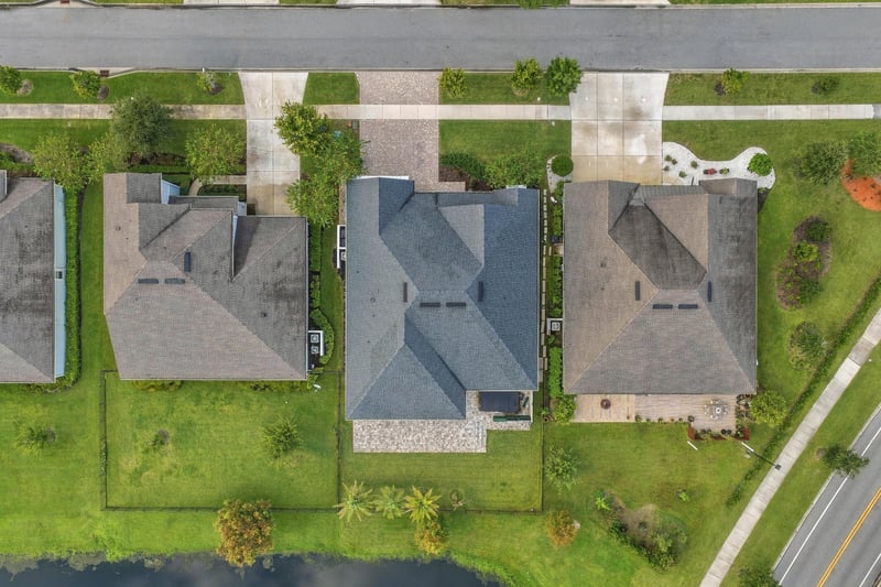 Overhead aerial of the home and neighboring rooftops along the street in Middleburg, FL