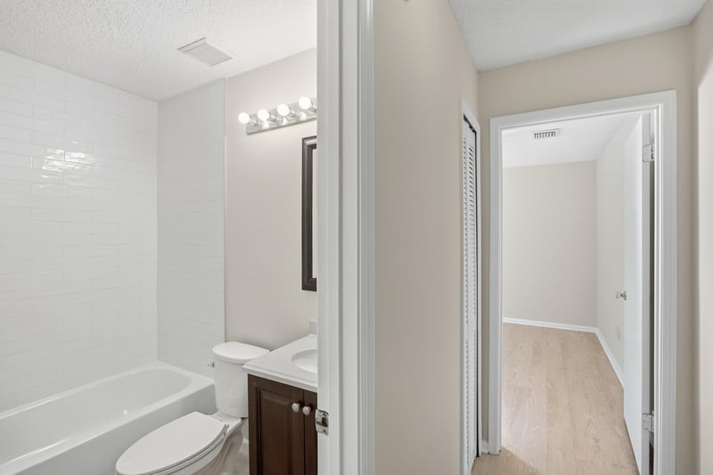 Bedroom view toward hallway and door at 678 5th Ave N, Jacksonville Beach, FL 32250