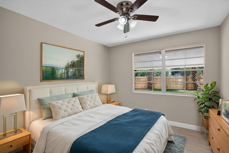 Bedroom with virtually staged bed and artwork at 4117 Wilcrest Ct, Jacksonville, FL 32277