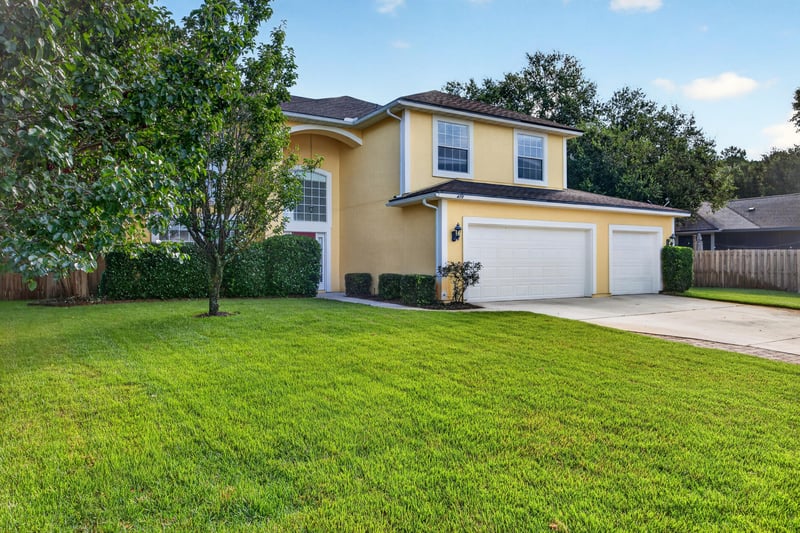 Front exterior from street, lawn and trees at 470 Sparrow Branch Cir, Jacksonville, FL 32259