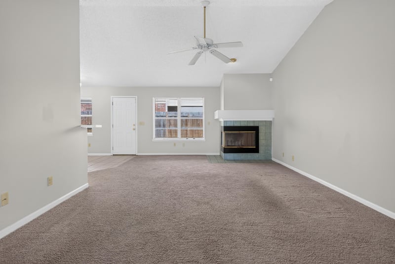 Living room with ceiling fan and tile fireplace at 400 Ashcroft Landing Dr, Jacksonville, FL 32225