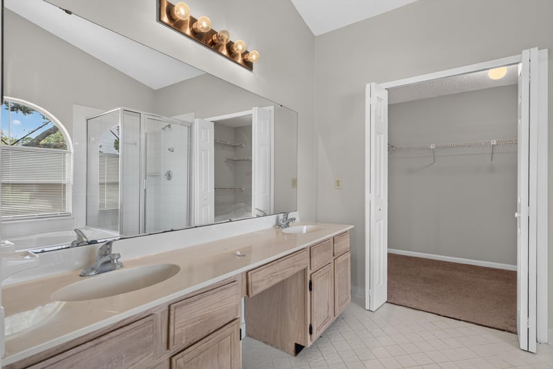 Primary bathroom vanity with mirror at 400 Ashcroft Landing Dr, Jacksonville, FL 32225