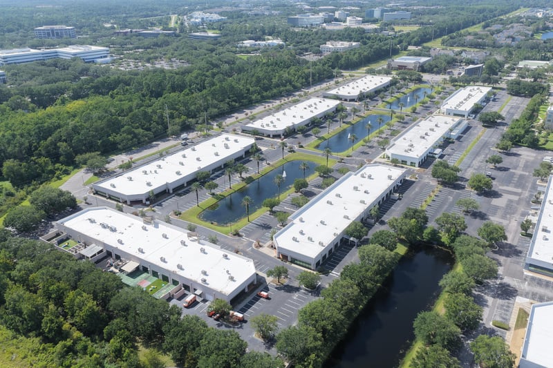 Aerial view of office park rooflines and tree line at 10550 Deerwood Park Blvd, Jacksonville, FL 32256