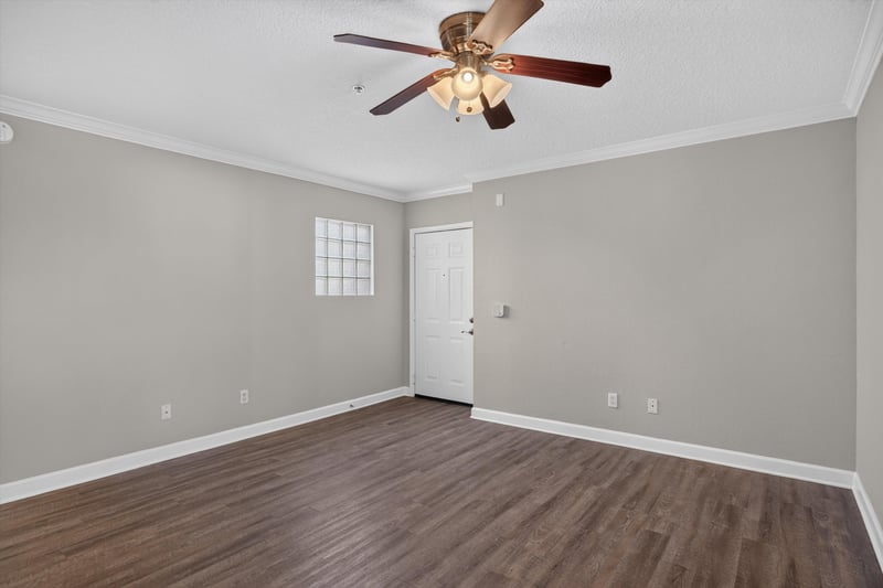 Empty room with hardwood floors at 1701 The Greens Way 1415, Jacksonville Beach, FL 32250