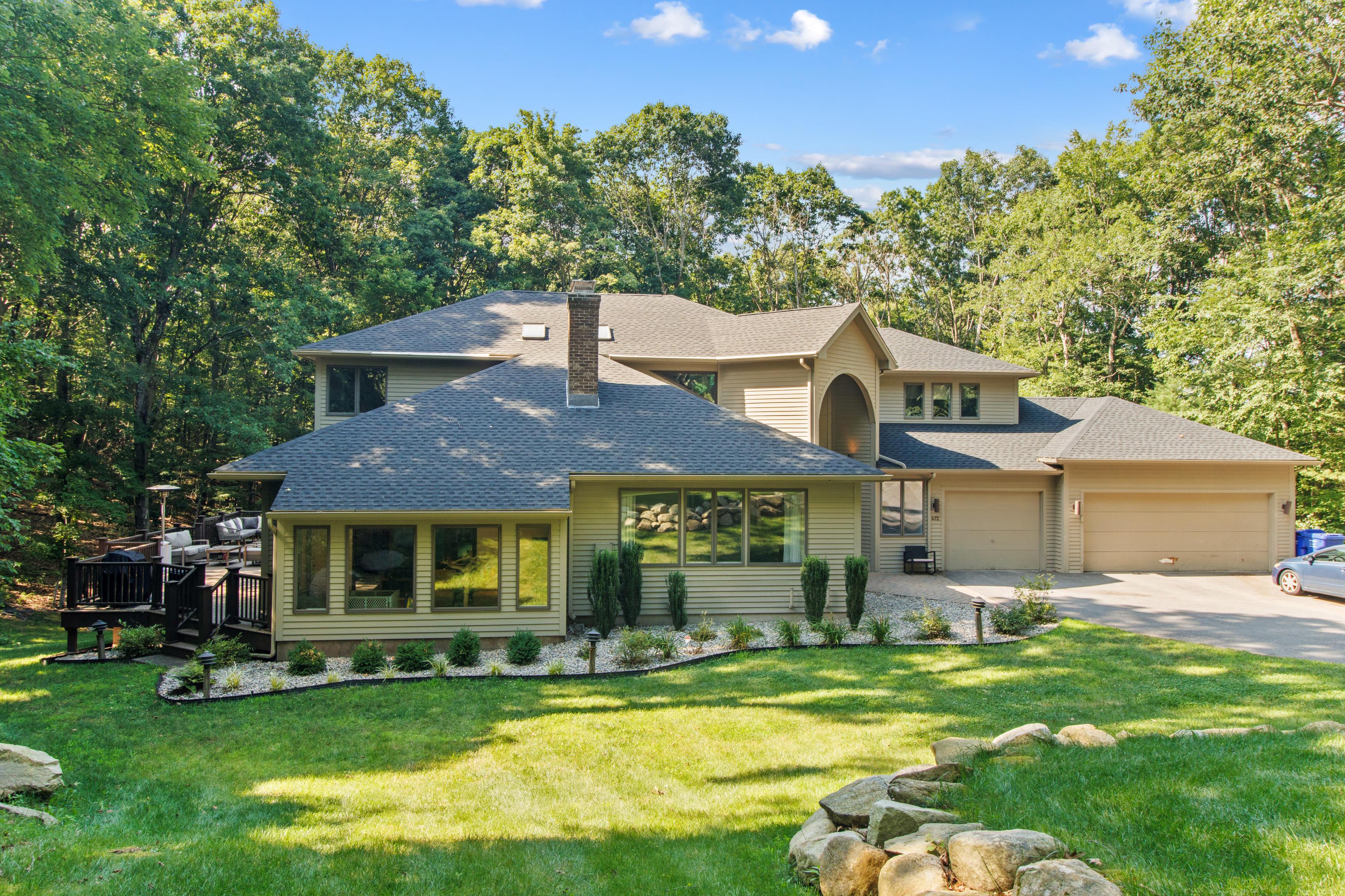 Contemporary home opening onto an expansive green lawn