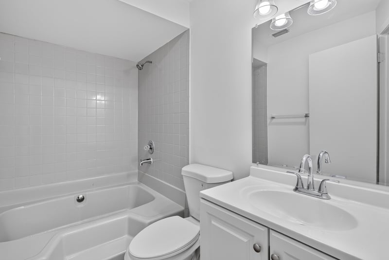 Bathroom with tub-shower combo and toilet at 8177 Virgo St, Jacksonville, FL 32216