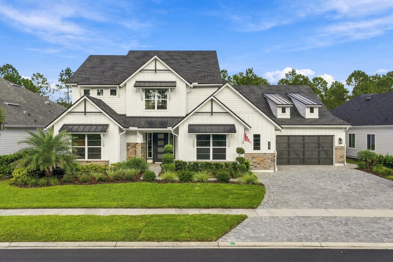Aerial front exterior with paver driveway at 907 Seagrove Dr, Ponte Vedra Beach, FL 32081