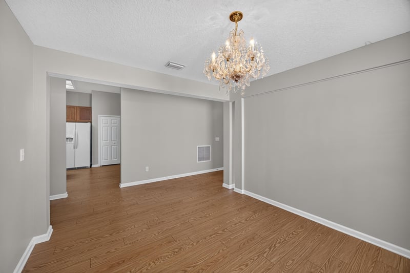Dining area with chandelier, another angle at 14147 Fish Eagle Dr E, Jacksonville, FL 32226