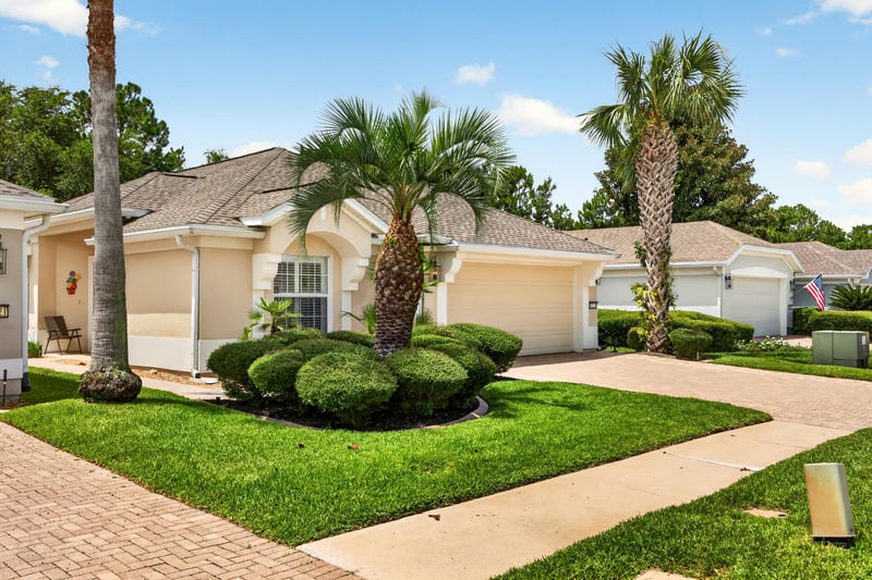 Front exterior with palm trees and walkway at 11225 Water Spring Cir, Jacksonville, FL 32256