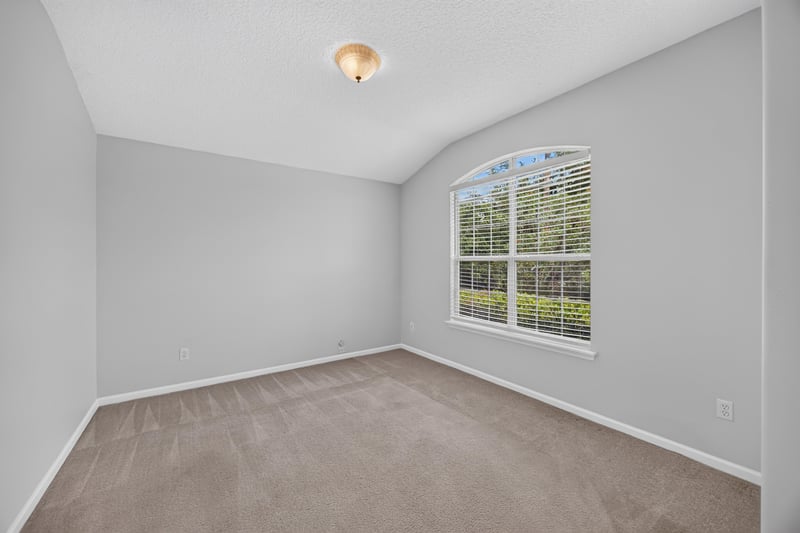 Empty room with carpet and window blinds at 2480 Ridge Will Dr, Jacksonville, FL 32246