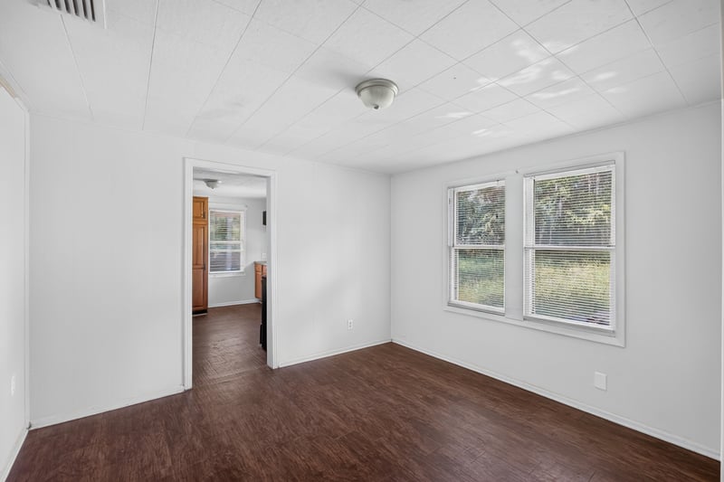 Hallway leading to kitchen with window at 2372 2nd Ave, Jacksonville, FL 32208