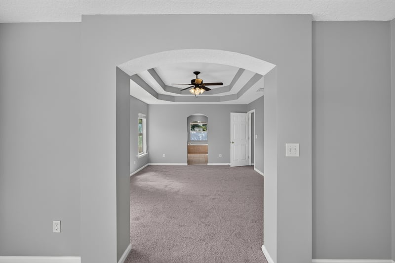 Hallway with tray ceiling at 470 Sparrow Branch Cir, Jacksonville, FL 32259