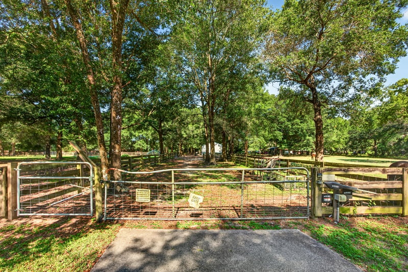 Fenced pasture gate with trees at 1735 Hagans Ridge Ct
