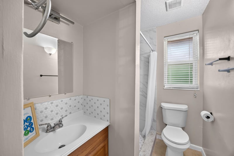 Bathroom vanity with mirror and toilet at 8067 Parental Cir, Jacksonville, FL 32216
