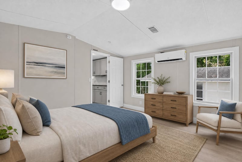 Primary bedroom staged with bed and chair at 4565 Appleton Ave, Jacksonville, FL