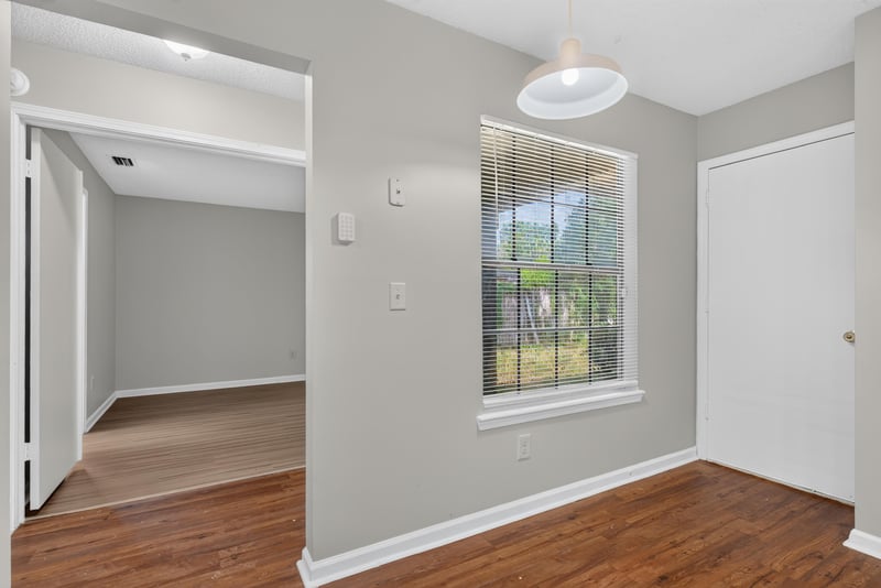 Kitchen opening to an adjoining room at 8010 International Village Dr, Jacksonville, FL 32277