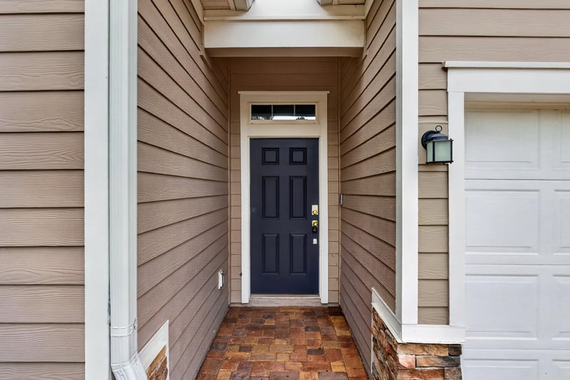 Front door entry with paver walkway at 9905 Ansley Lake Dr, Jacksonville, FL