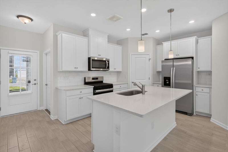 Kitchen island with stainless appliances at 39 Mellowood Ln, St. Augustine, FL 32092