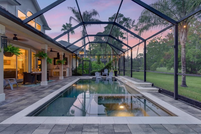 Pool and lanai at day-to-dusk at 2304 Spring Hill Ct, Orange Park, FL
