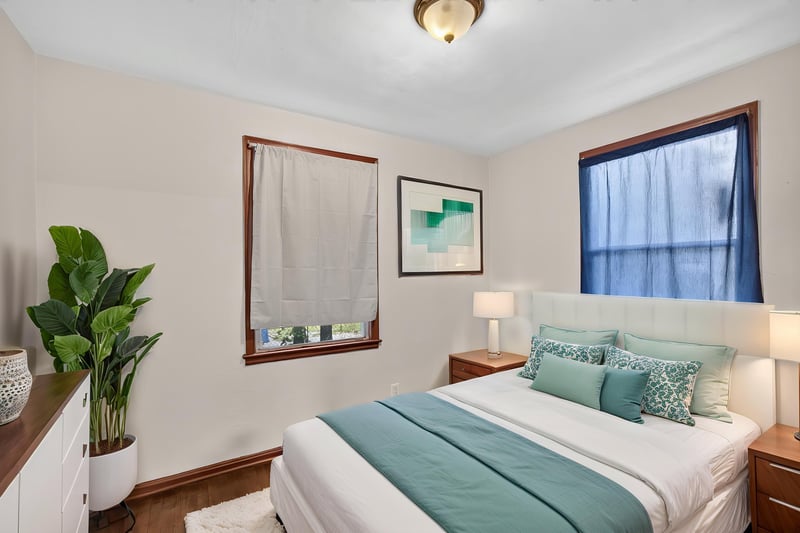 Primary bedroom staged with teal bedding at 2132 Allandale Cir W, Jacksonville, FL