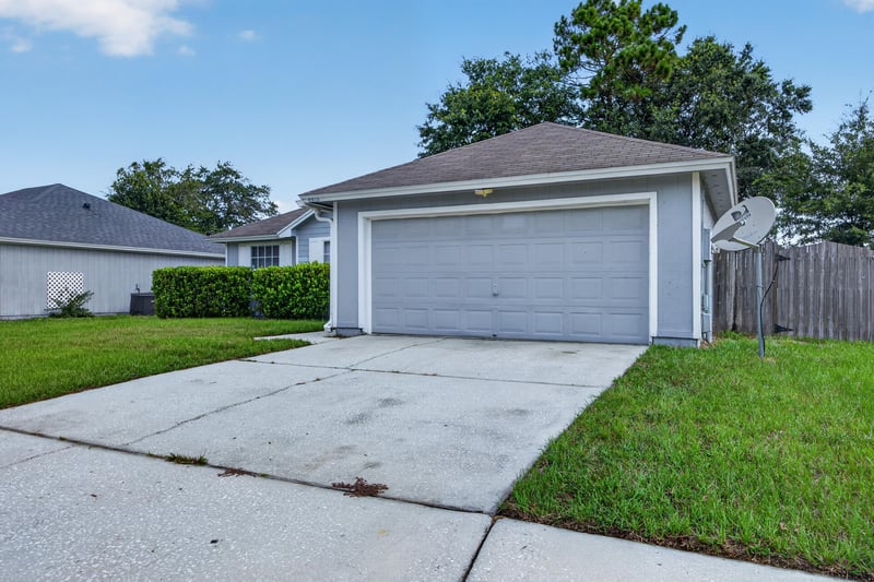 Front exterior, straight-on driveway view at 8519 Blazing Star Ct, Jacksonville, FL 32210