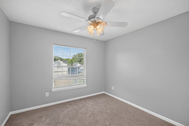 Empty bedroom with carpet and window at 470 Sparrow Branch Cir, Jacksonville, FL 32259