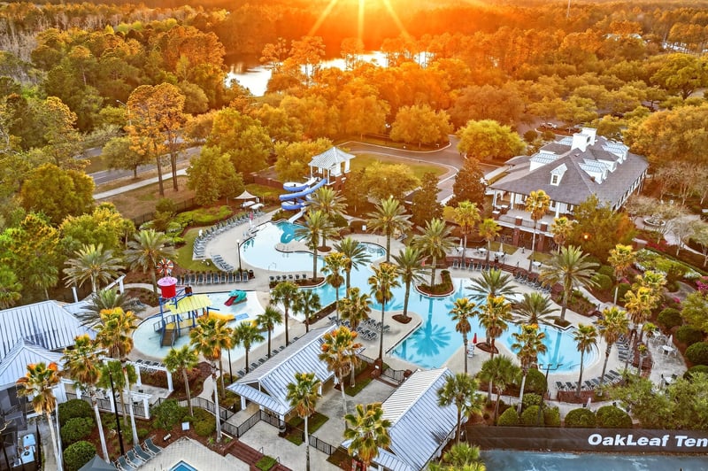 Aerial view of water park pools at day-to-dusk in Oakleaf Plantation