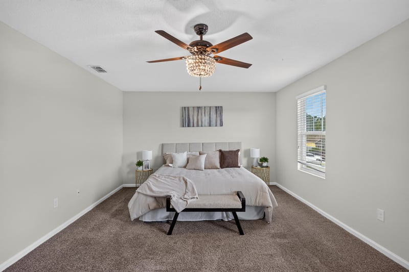 Primary bedroom with bed and window at 6830 Hanford St, Jacksonville, FL 32219