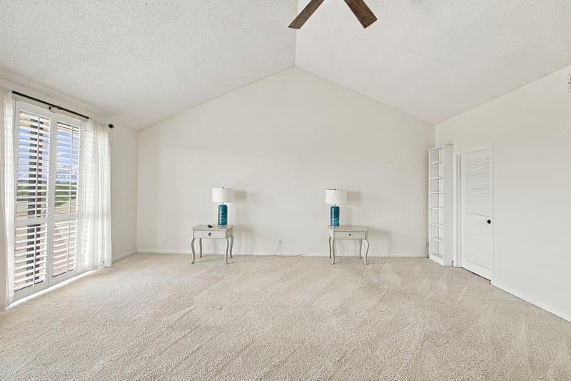 Empty bedroom with carpet and plantation shutters at 752 Spinnakers Reach Dr, Ponte Vedra Beach, FL 32082