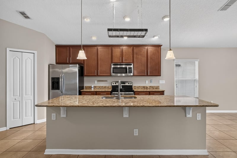 Kitchen with granite counters and pendant lighting at 469 Glendale Ln, Orange Park, FL
