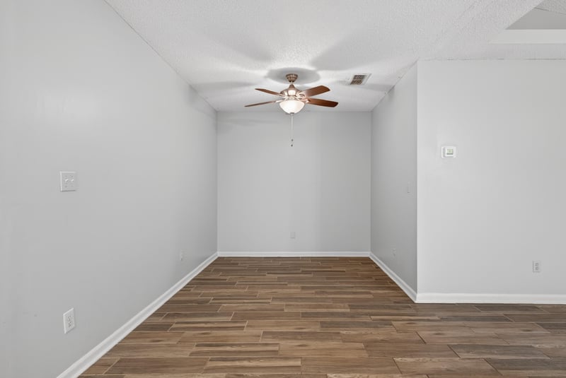 Empty room with wood-look flooring at 2164 Orangewood St, Middleburg, FL 32068